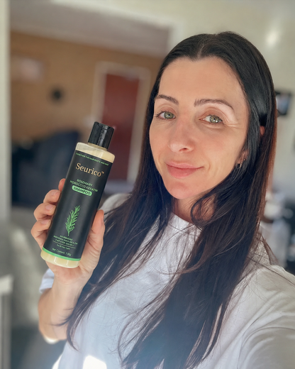 Customer holding Seurico rosemary shampoo