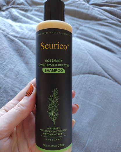 Customer hand holding Seurico shampoo bottle
