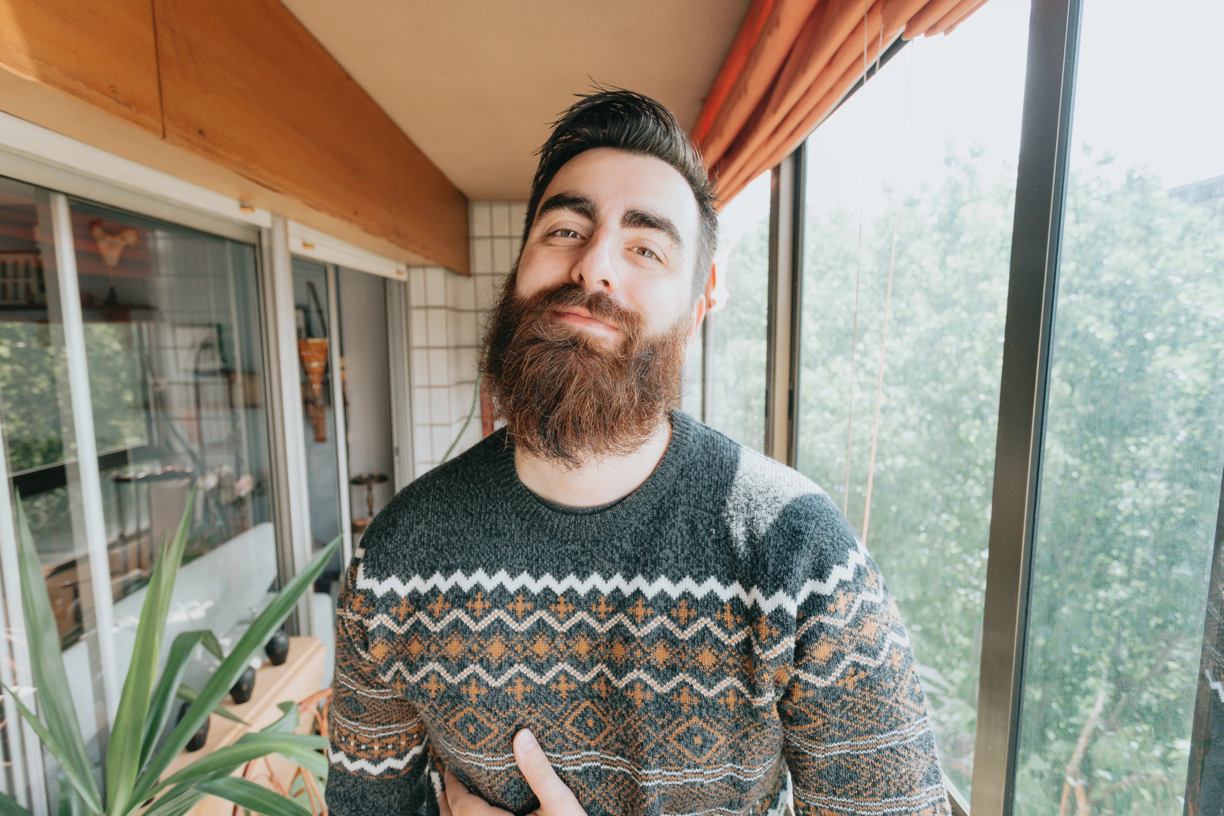 files/imgi_17_man-in-grey-and-orange-softly-smiles-at-the-camera.jpg